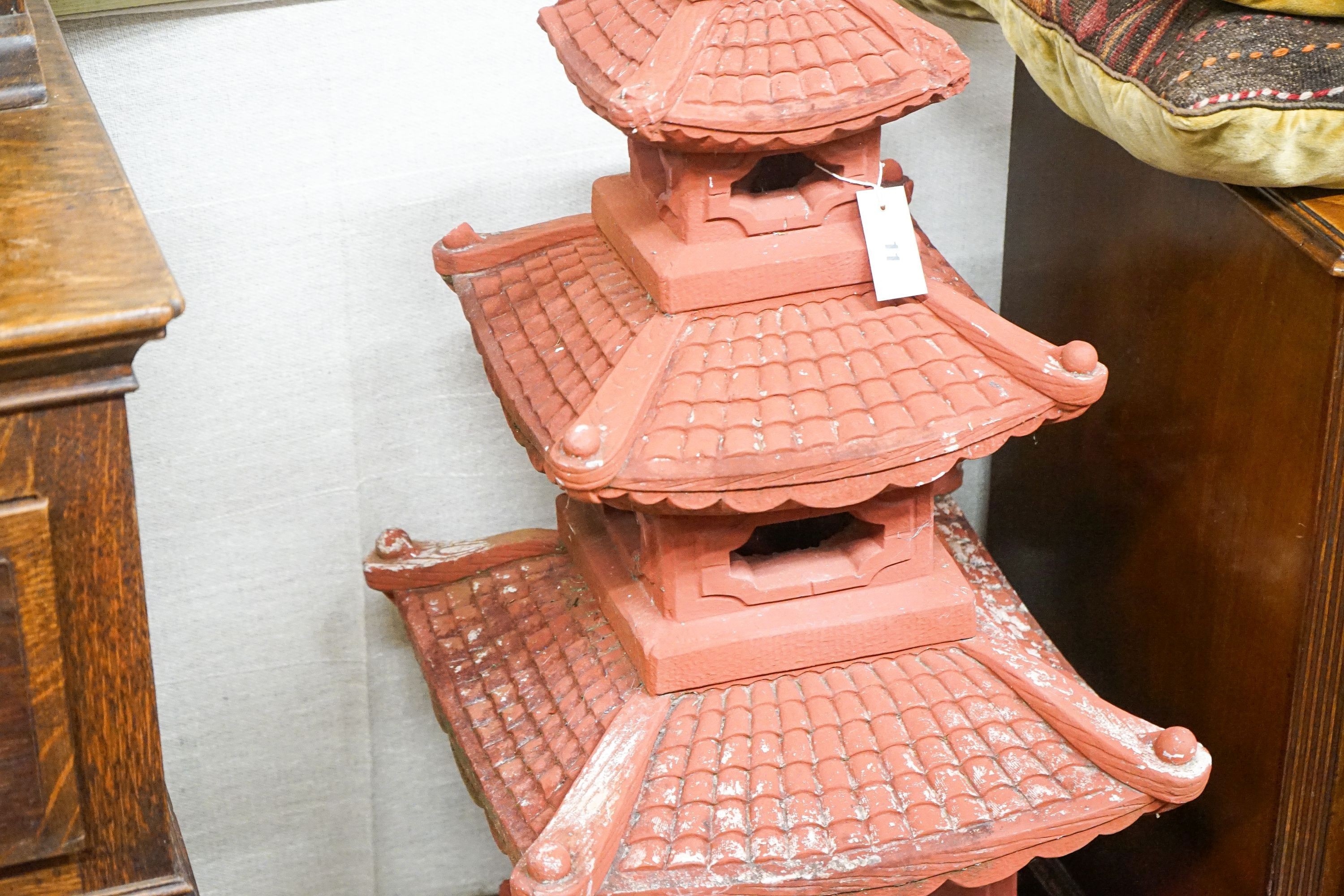 A painted reconstituted stone sectional pagoda garden ornament, height 104cm